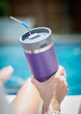 portable bluetooth speaker by the pool on a purple yeti 20oz tumbler