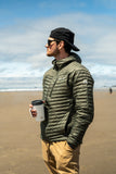 Sip tumbler with portable bluetooth speaker lid at the beach on a chilly day