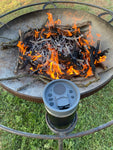 black yeti with bluetooth speaker by the fire pit
