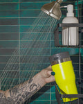 bluetooth waterproof speaker lid on a yellow tumbler in the shower